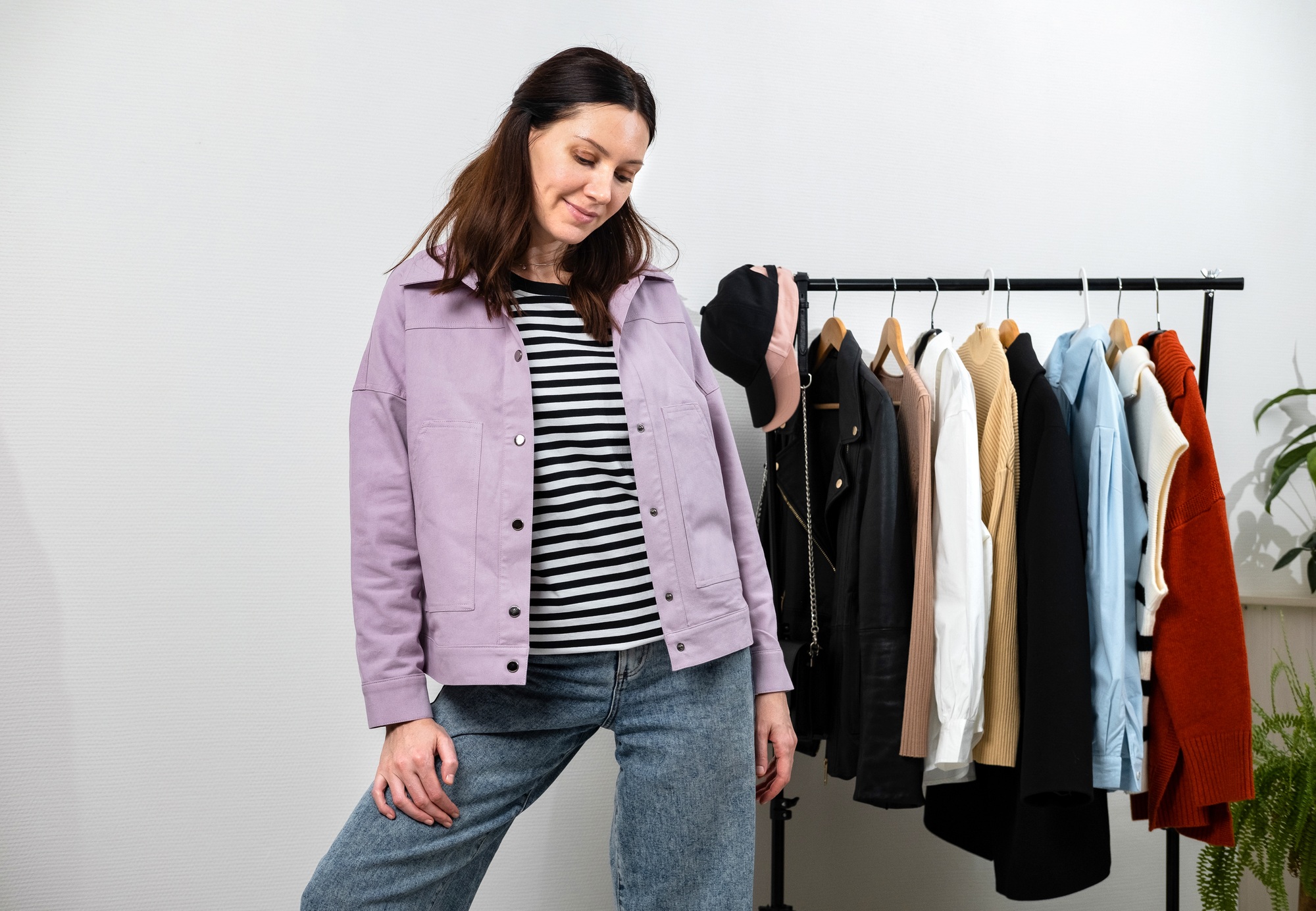 Beautiful lady stylist choosing her fashion outfit clothes. Home wardrobe, selection of a wardrobe