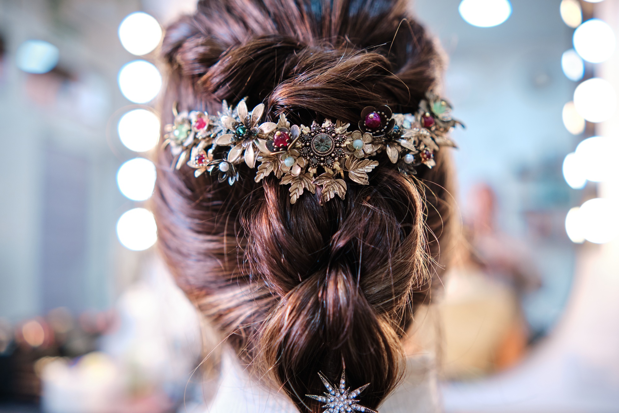 Close up view of a stylish hairstyle with elegant hair accessories.
