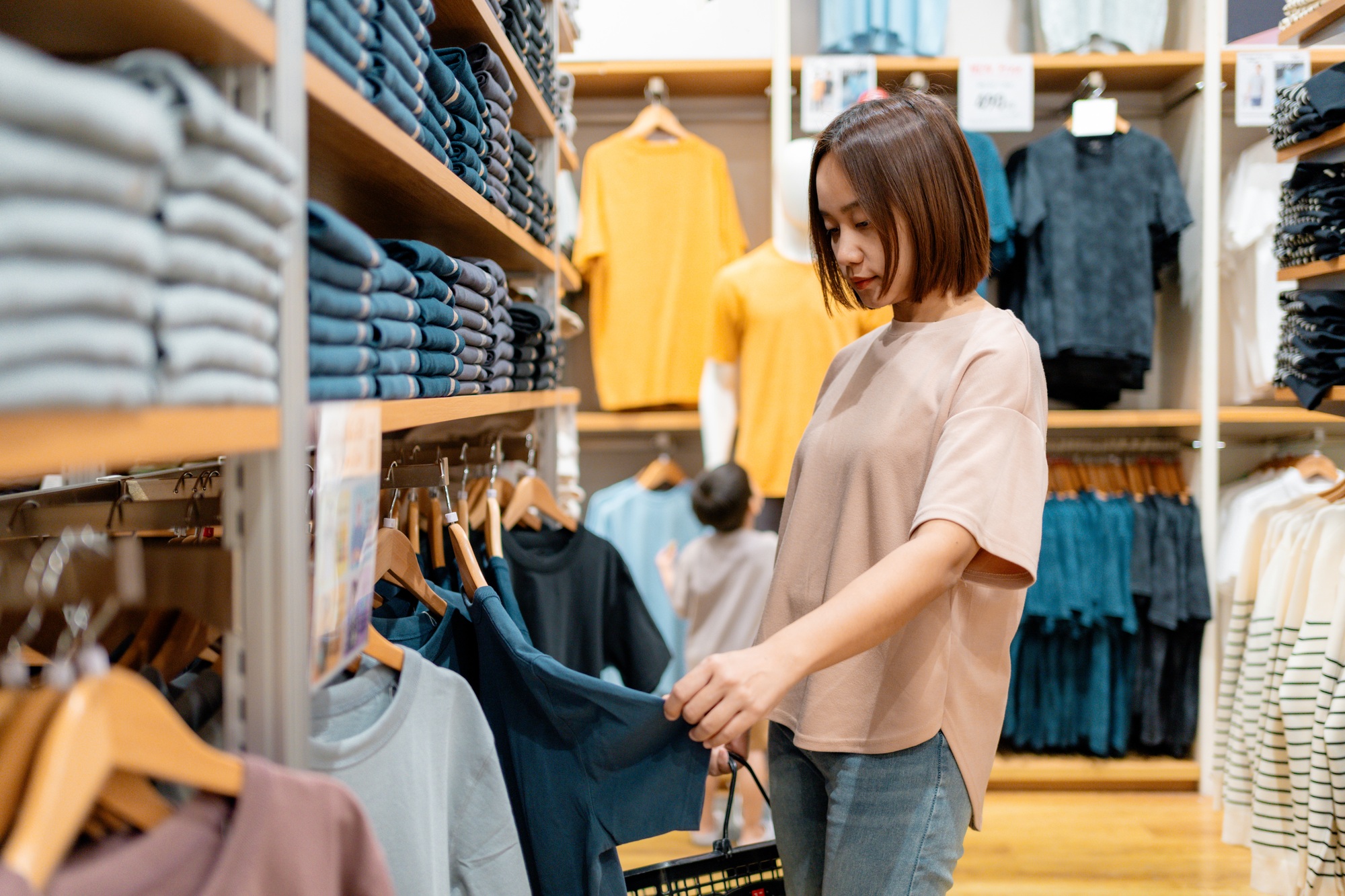 Woman choosing clothes in a fashion store