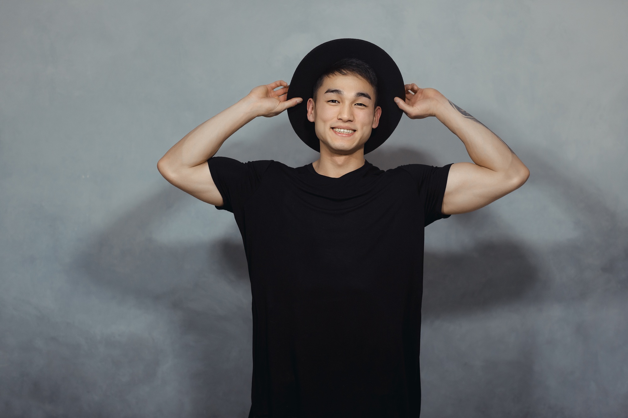 Fashion Asian Man in Black Clothes Indoors